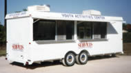 20′ Concession Trailer with Windows, Graphics, Air Conditioners, Cooking Equipment and Stainless Fold-out Counters - Thumbnail